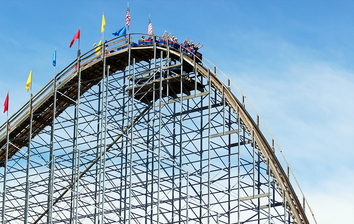A train begins to crest the first hill on The Voyage Wooden Roller Coaster at Holiday World & Splashin' Safari in Santa Claus, Indiana