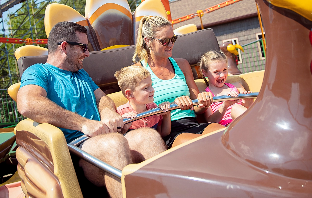 A family gets ready to ride Turkey Whirl at Holiday World & Splashin' Safari in Santa Claus, Indiana.